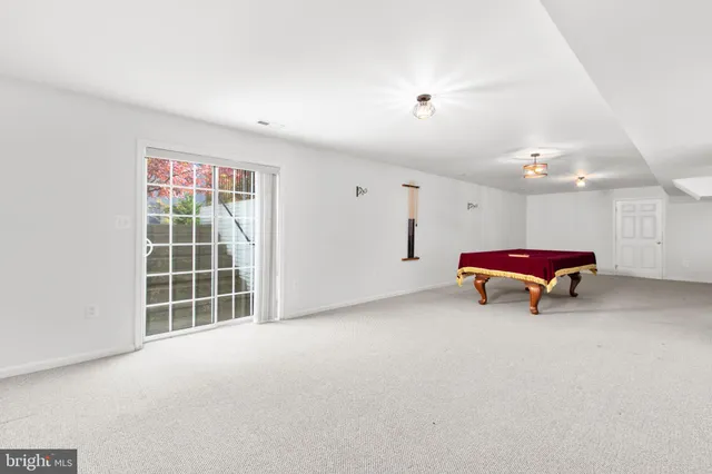 a front view of a house with a large window