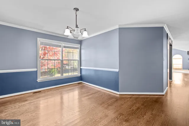 a view of a livingroom with wooden floor