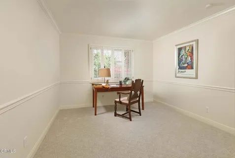 a workspace with furniture and a window