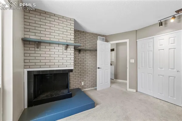 a view of a livingroom with a fireplace