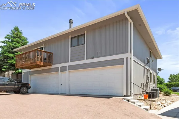 a view of a house with a street