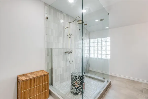 a bathroom with a shower and a sink