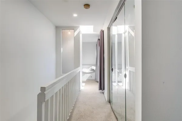 a room with a granite countertop sink and natural light