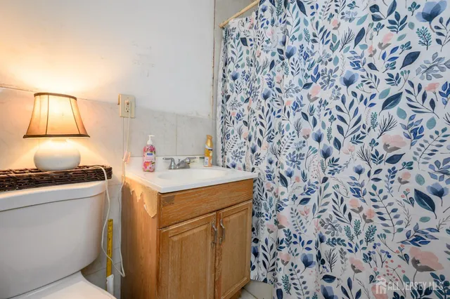 a view of a room with two chairs and a window