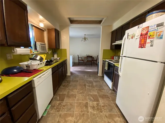 a kitchen with a sink stove and refrigerator