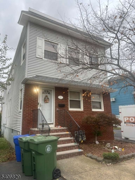 a front view of a house with garage