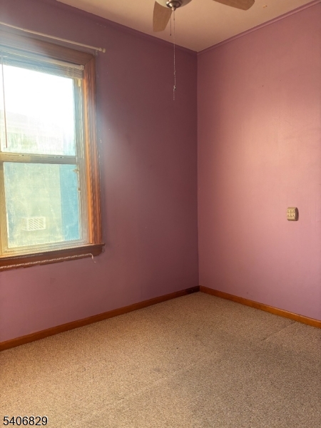21 Main Street Linden, NJ 07036 - Photo 11 of 19 an empty room with a window