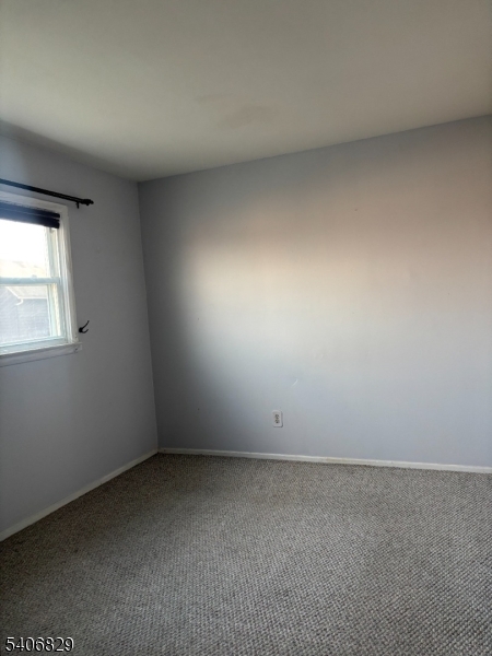 21 Main Street Linden, NJ 07036 - Photo 16 of 19 an empty room with a window