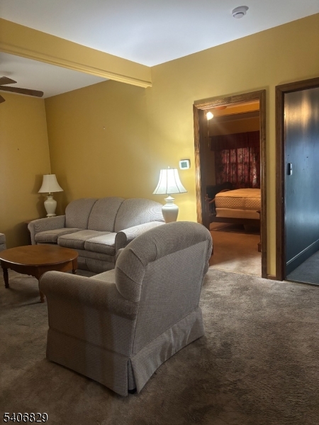 21 Main Street Linden, NJ 07036 - Photo 4 of 19 a living room with furniture and a glass door