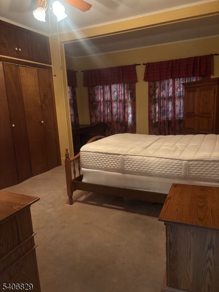 21 Main Street Linden, NJ 07036 - Photo 7 of 19 a bedroom with a bed and a dresser