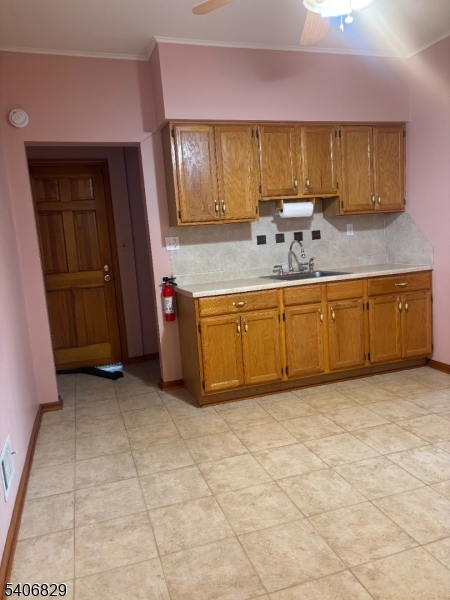 21 Main Street Linden, NJ 07036 - Photo 10 of 19 a view of kitchen with granite countertop stainless steel appliances stove sink and cabinets
