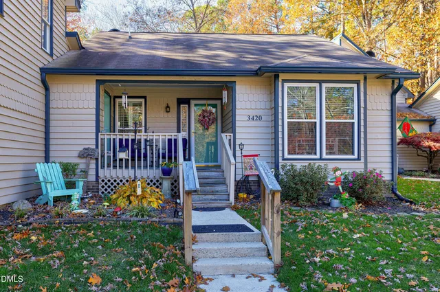 a view of outside house with a yard