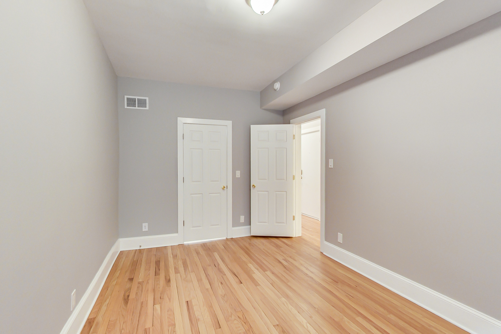 932 Pleasant Street, Unit 2W Oak Park, IL 60302 - Photo 15 of 21 a view of empty room with wooden floor