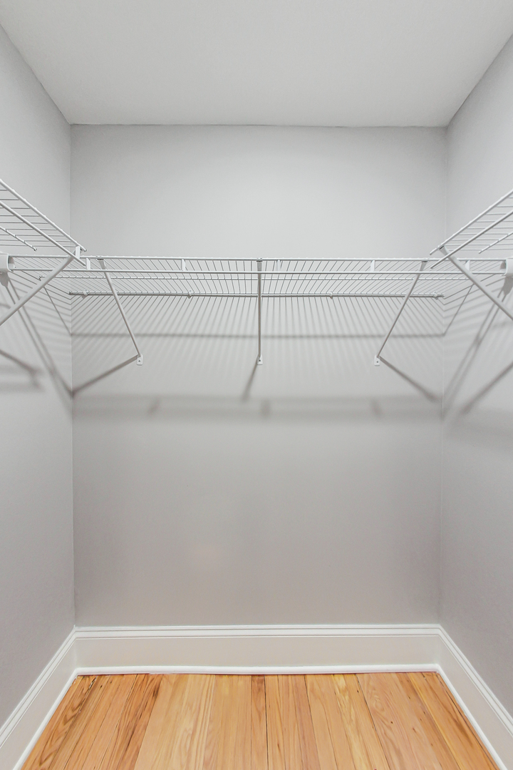 932 Pleasant Street, Unit 2W Oak Park, IL 60302 - Photo 16 of 21 a view of a room with racks on the wall