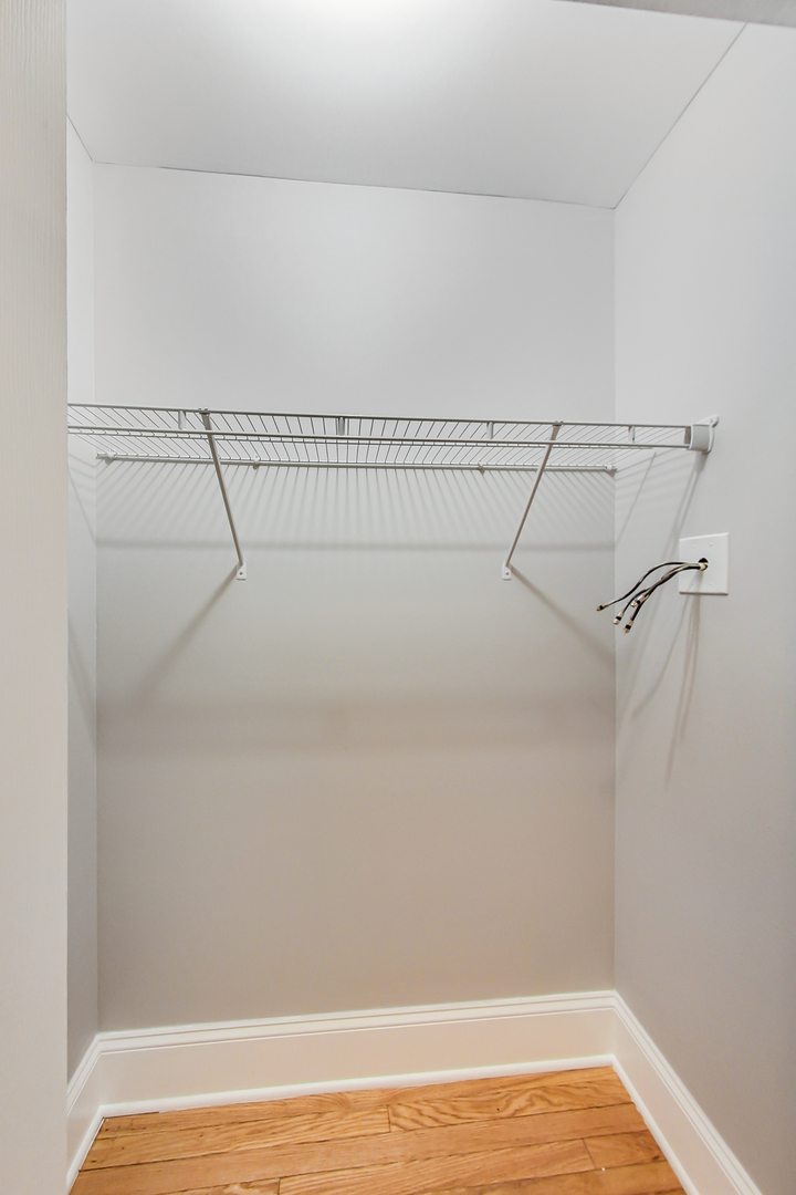 932 Pleasant Street, Unit 2W Oak Park, IL 60302 - Photo 17 of 21 a view of a room with racks on the wall