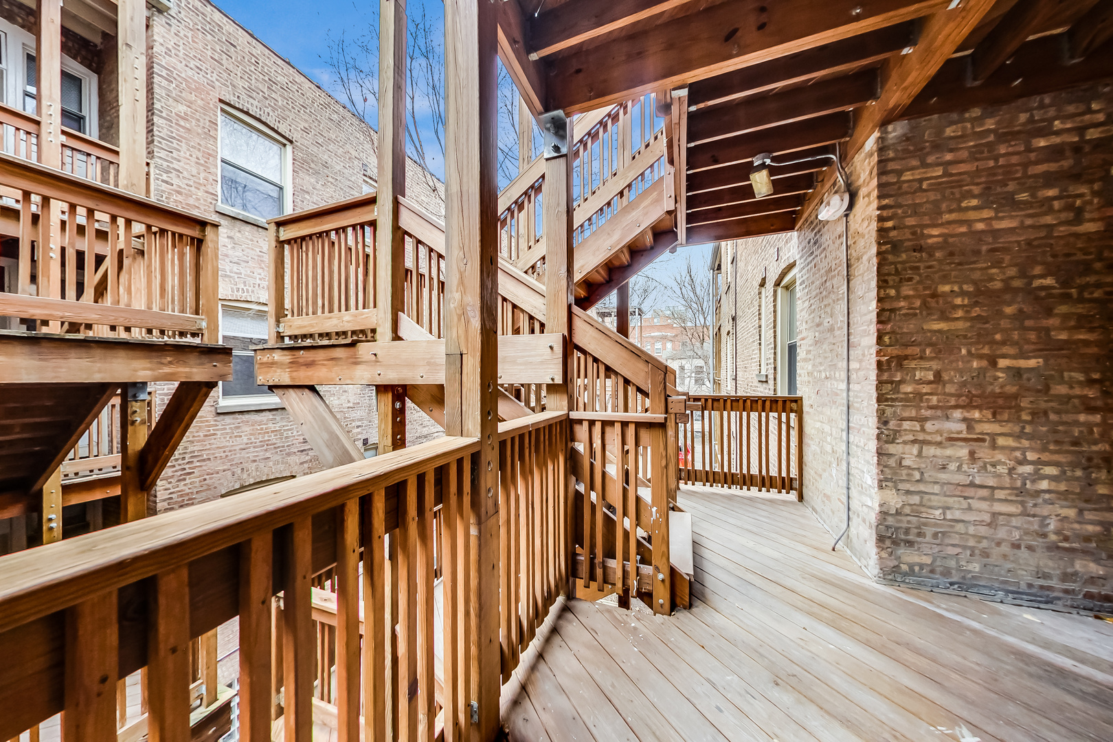 932 Pleasant Street, Unit 2W Oak Park, IL 60302 - Photo 20 of 21 a view of a balcony with wooden floor and stairs