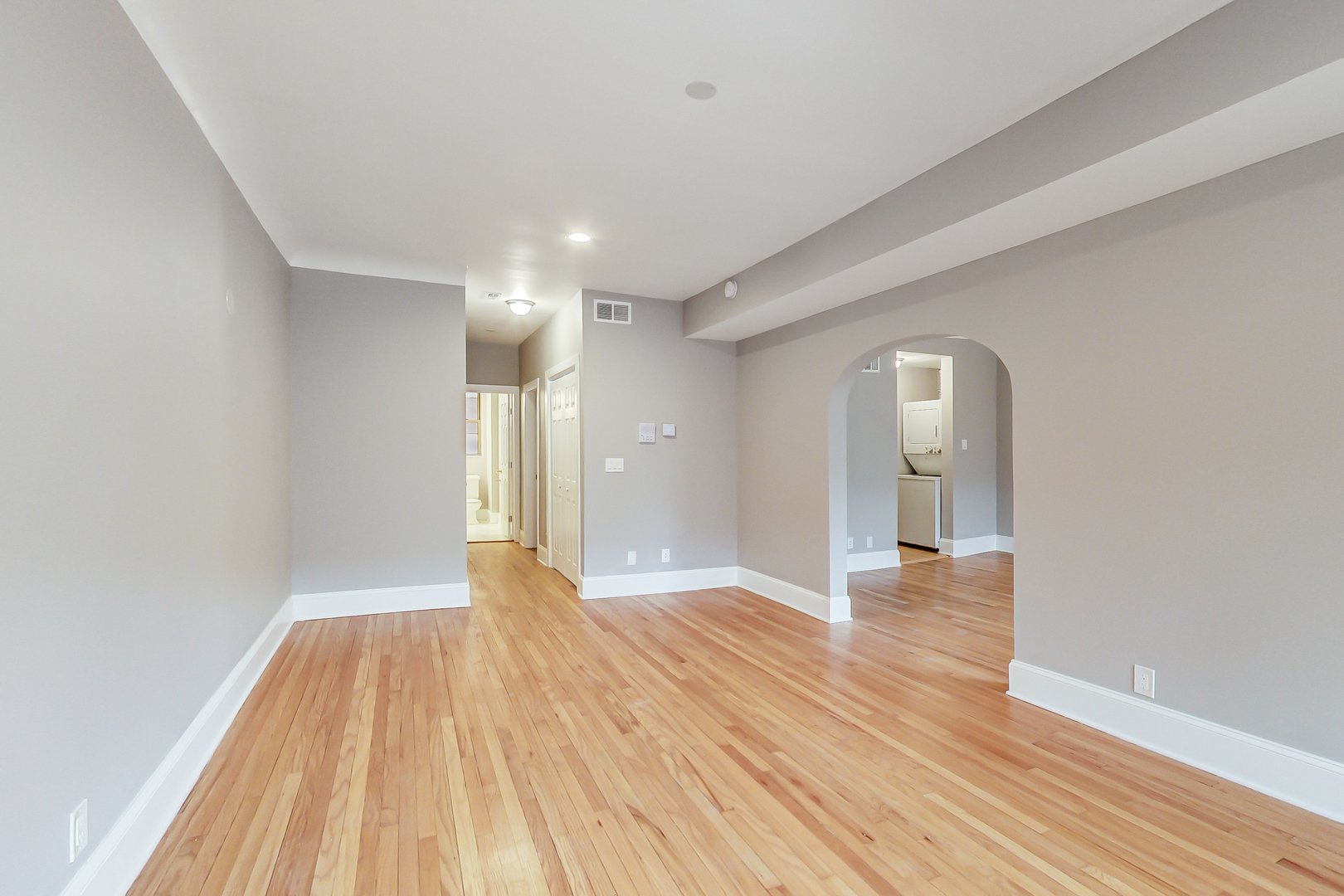 932 Pleasant Street, Unit 2W Oak Park, IL 60302 - Photo 6 of 21 a view of an empty room and wooden floor