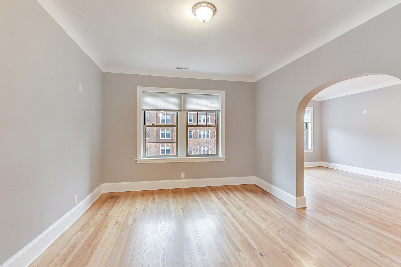 932 Pleasant Street, Unit 2W Oak Park, IL 60302 - Photo 8 of 21 wooden floor in an empty room with a window