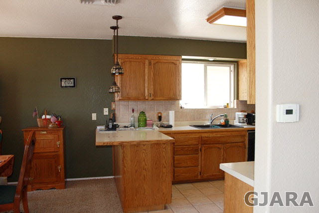 2933 El Torro Road Grand Junction, CO 81503 - Photo 8 of 9 a kitchen with a sink cabinets and window