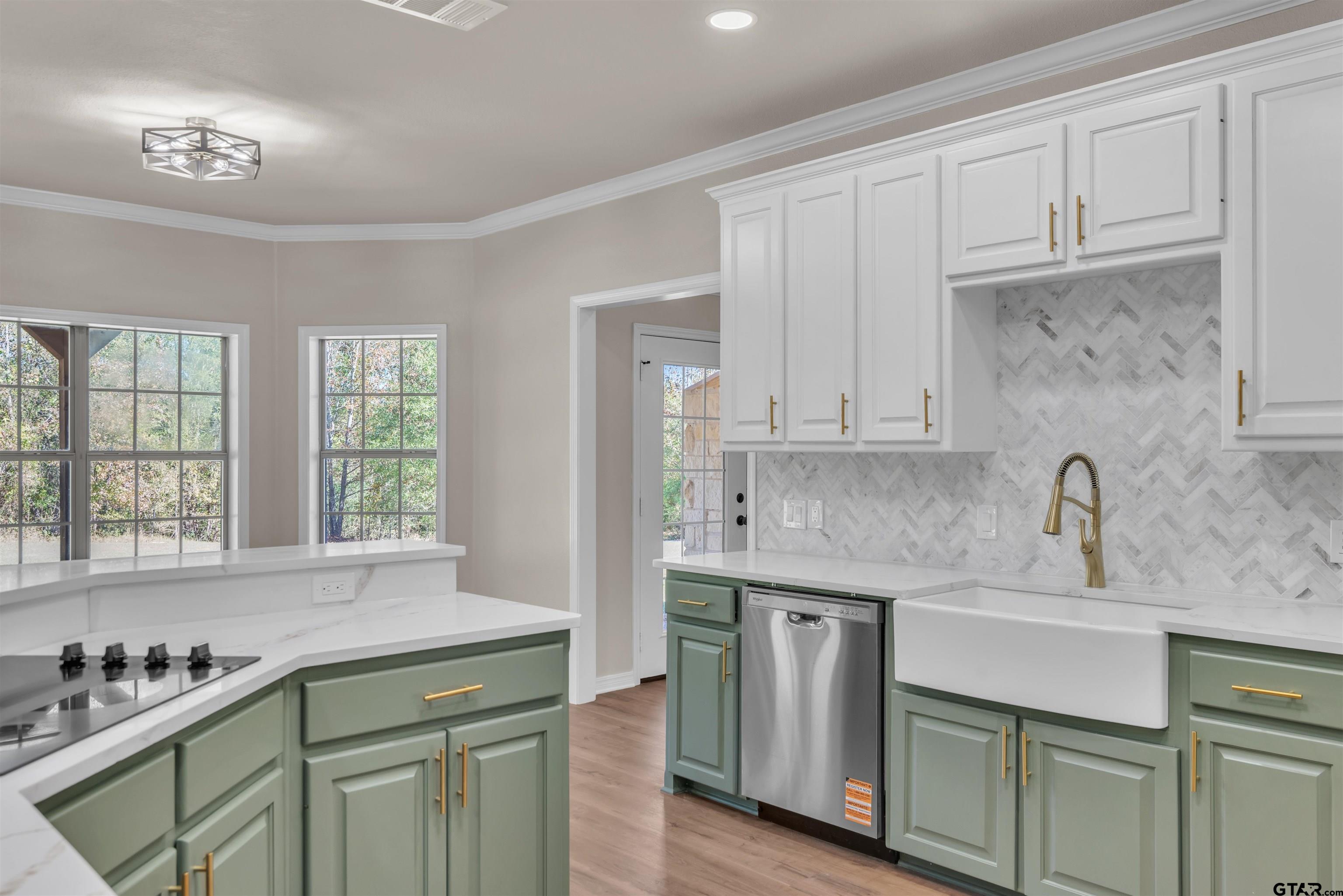 7589 Weeping Willow Road Big Sandy, TX 75755 - Photo 12 of 48 a kitchen with stainless steel appliances granite countertop a sink stove and cabinets