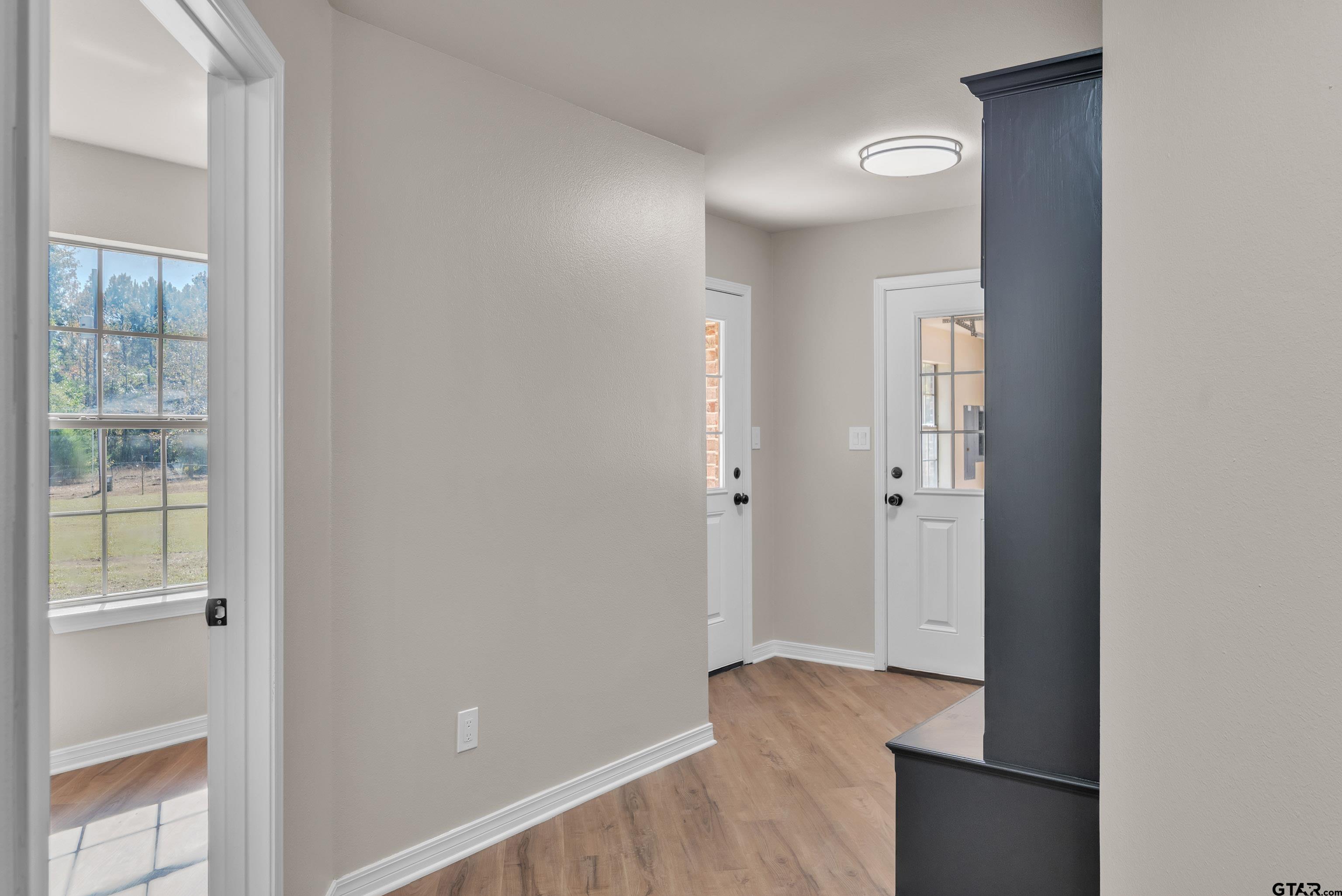 7589 Weeping Willow Road Big Sandy, TX 75755 - Photo 39 of 48 a view of hallway with closet and wooden floor