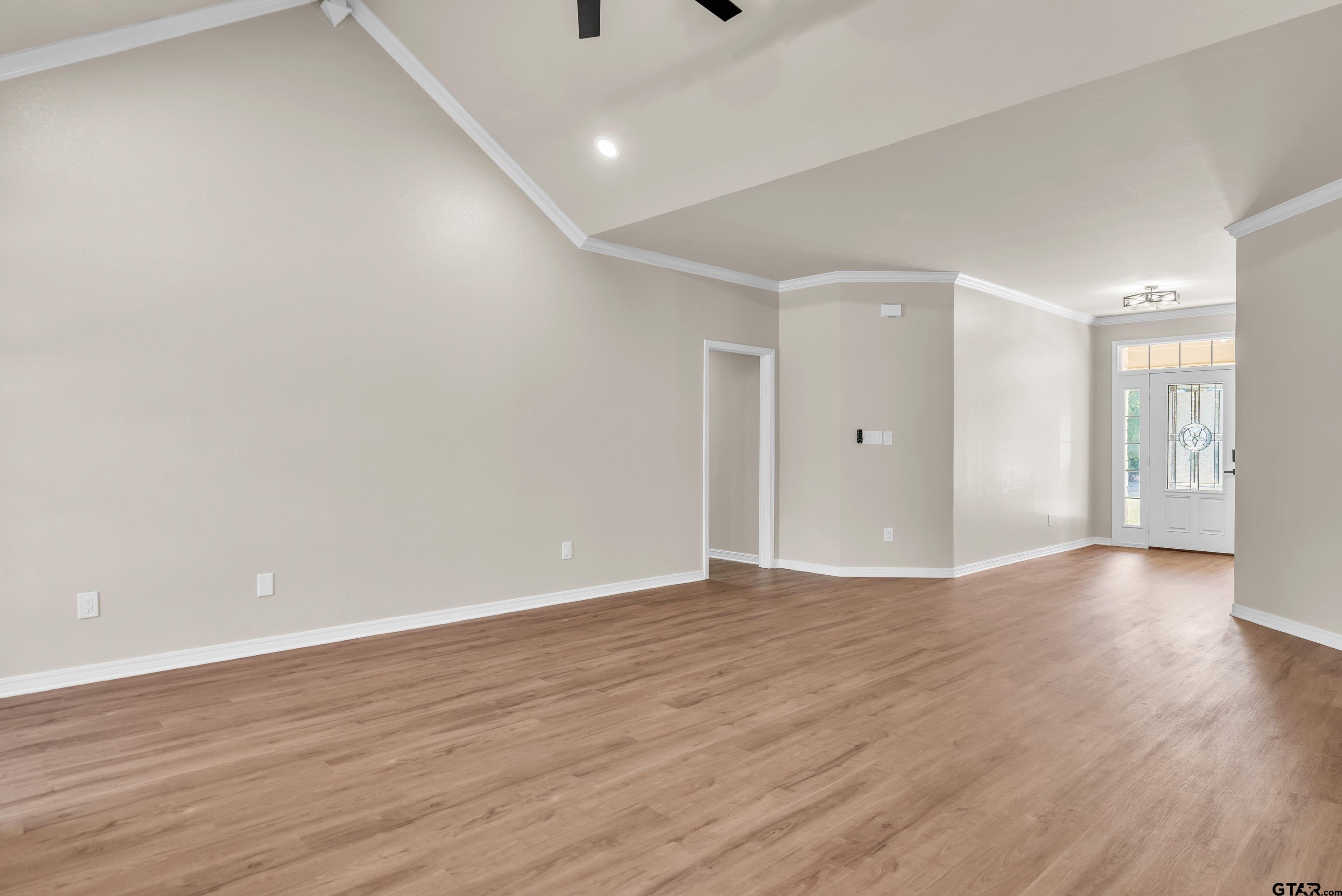 7589 Weeping Willow Road Big Sandy, TX 75755 - Photo 7 of 48 a view of an empty room with wooden floor