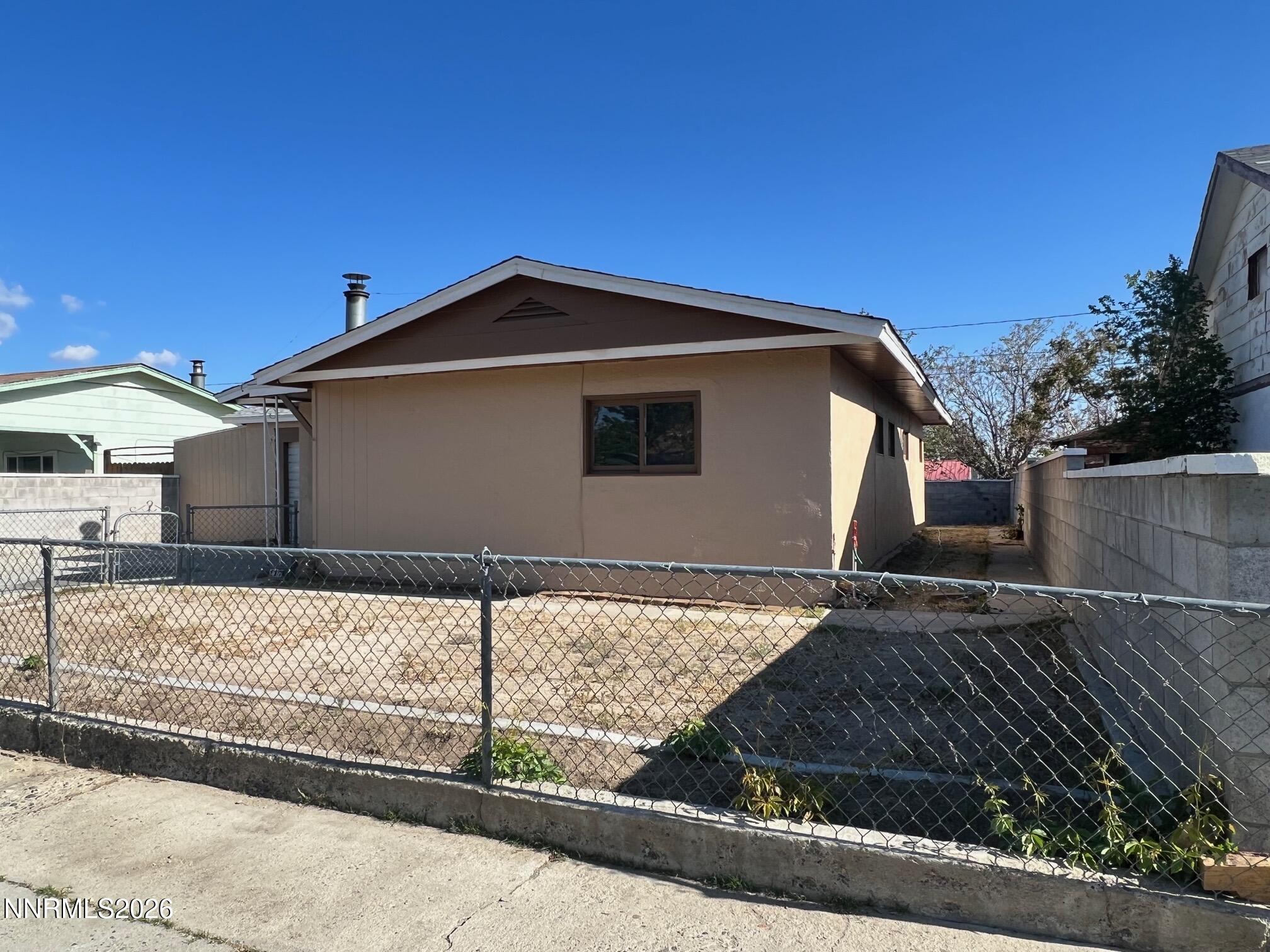 117 West 4th Street Hawthorne, NV 89415 - Photo 2 of 47 a front view of a house with garage