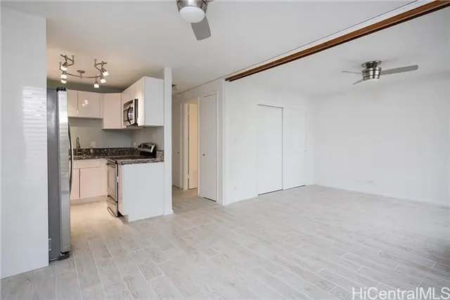 a view of kitchen with cabinets and wooden floor