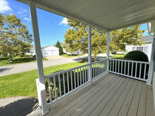a view of a porch with wooden floor
