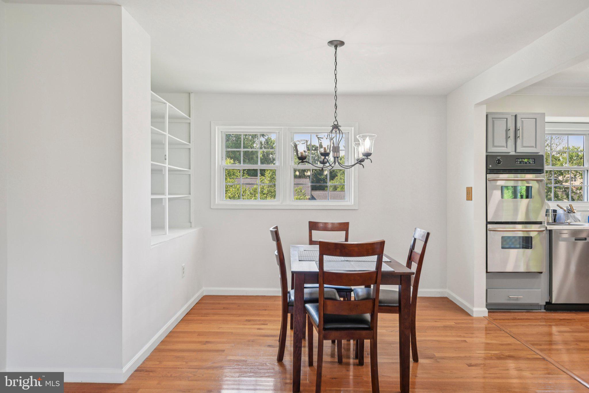 1005 Kings Tree Drive Bowie, MD 20721 - Photo 5 of 71 a view of a dining room with furniture window and wooden floor