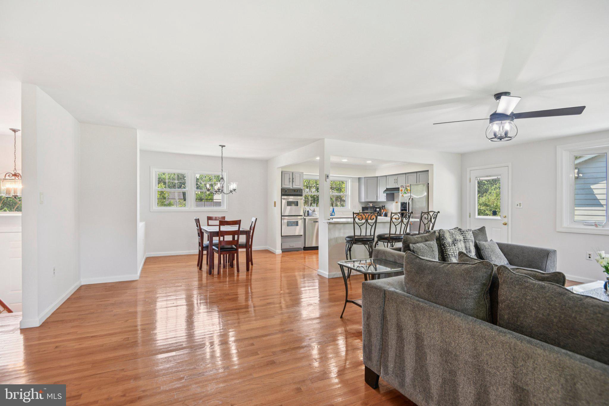 1005 Kings Tree Drive Bowie, MD 20721 - Photo 7 of 71 a living room with furniture wooden floor and a table