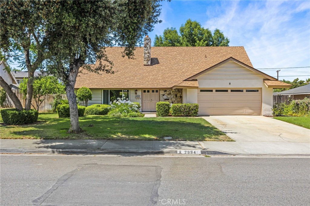 2994 Bautista Street Riverside, CA 92506 - Photo 1 of 37 a house that has a tree in front of it