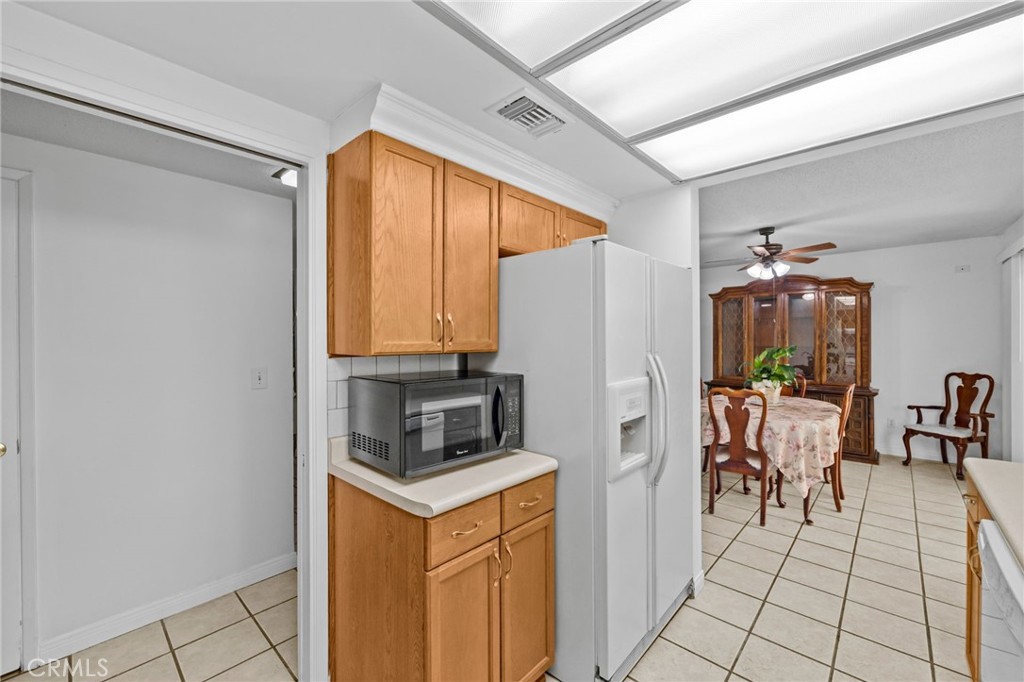 2994 Bautista Street Riverside, CA 92506 - Photo 17 of 37 a kitchen with stainless steel appliances granite countertop a refrigerator and a stove
