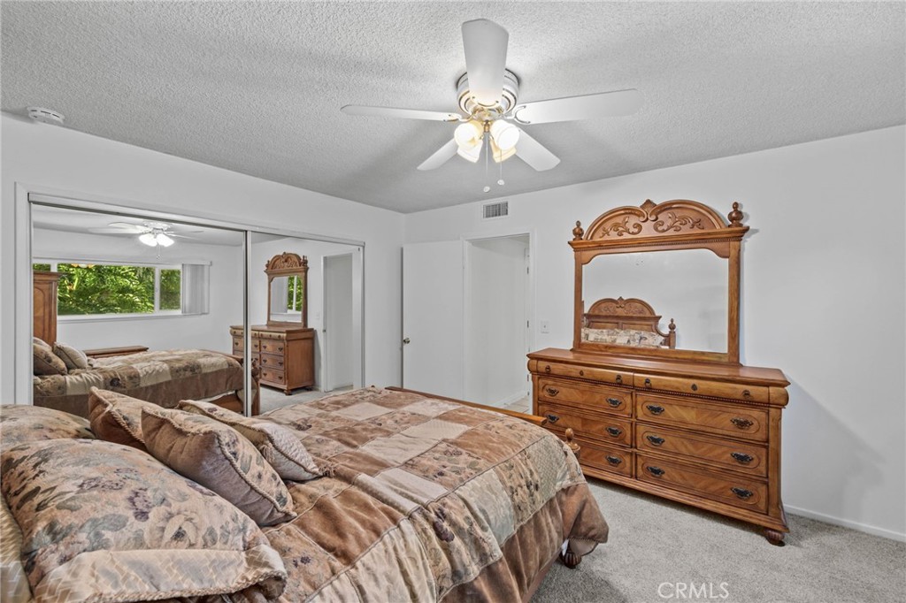 2994 Bautista Street Riverside, CA 92506 - Photo 23 of 37 a bedroom with a bed and wooden floor