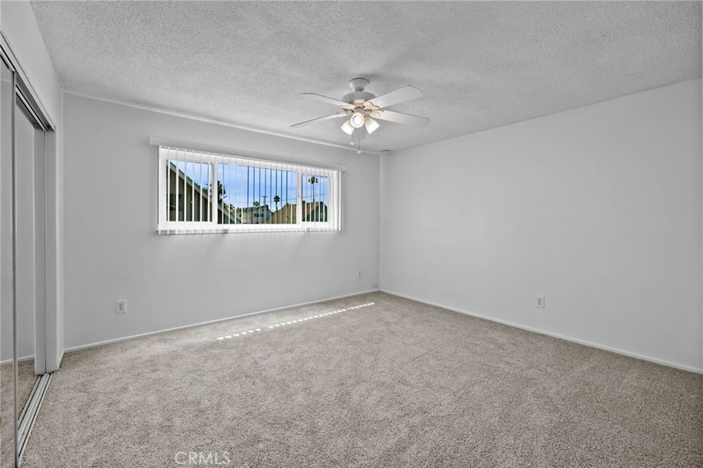 2994 Bautista Street Riverside, CA 92506 - Photo 24 of 37 an empty room with a window and ceiling fan