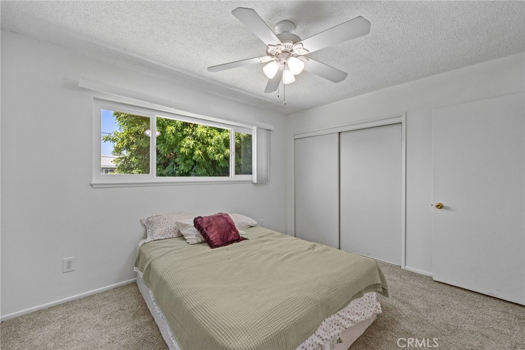 2994 Bautista Street Riverside, CA 92506 - Photo 27 of 37 a bedroom with a bed and a chandelier