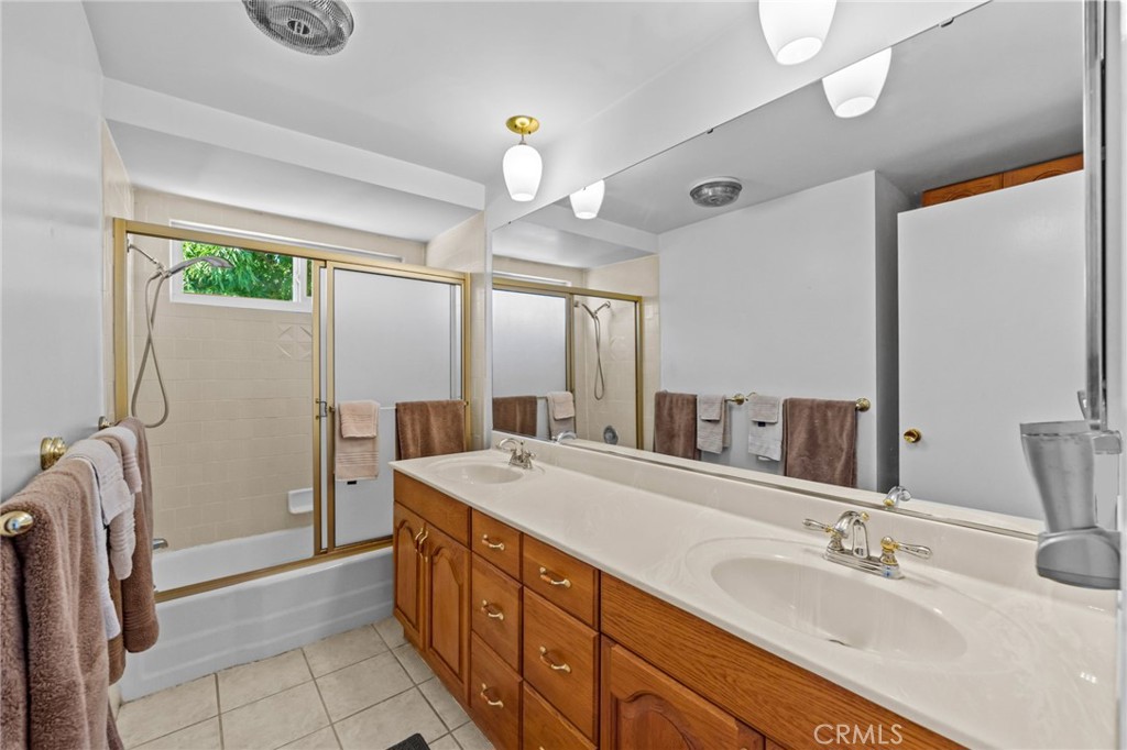 2994 Bautista Street Riverside, CA 92506 - Photo 28 of 37 a spacious bathroom with a double vanity sink mirror and shower