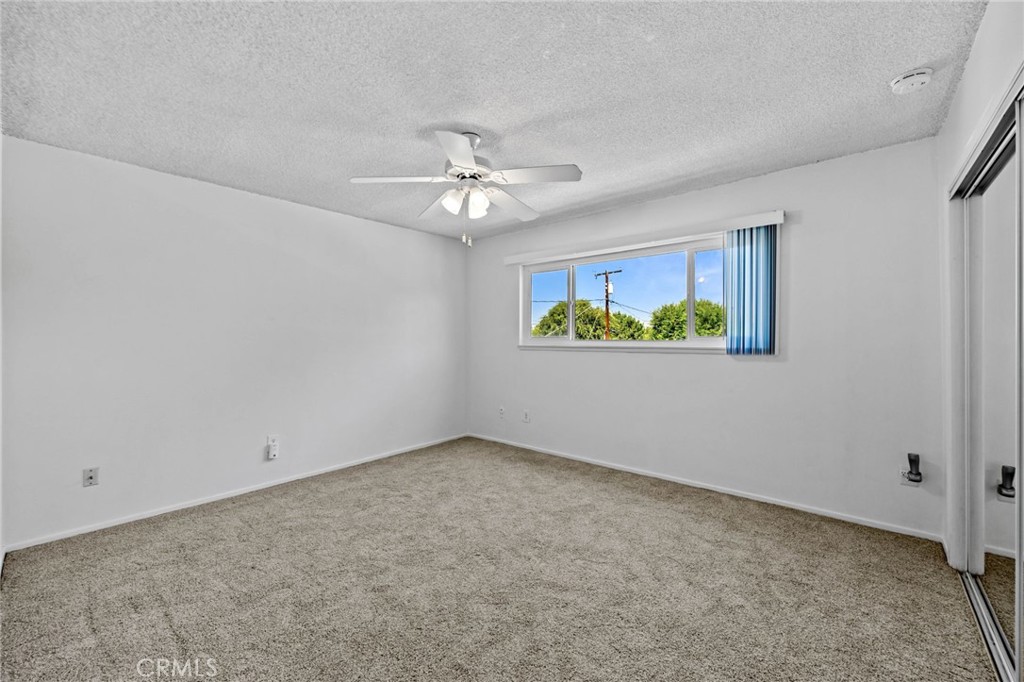 2994 Bautista Street Riverside, CA 92506 - Photo 29 of 37 an empty room with windows and ceiling fan
