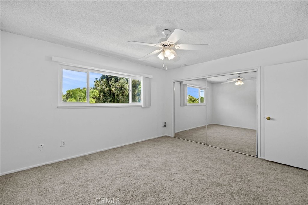 2994 Bautista Street Riverside, CA 92506 - Photo 30 of 37 an empty room with windows and ceiling fan