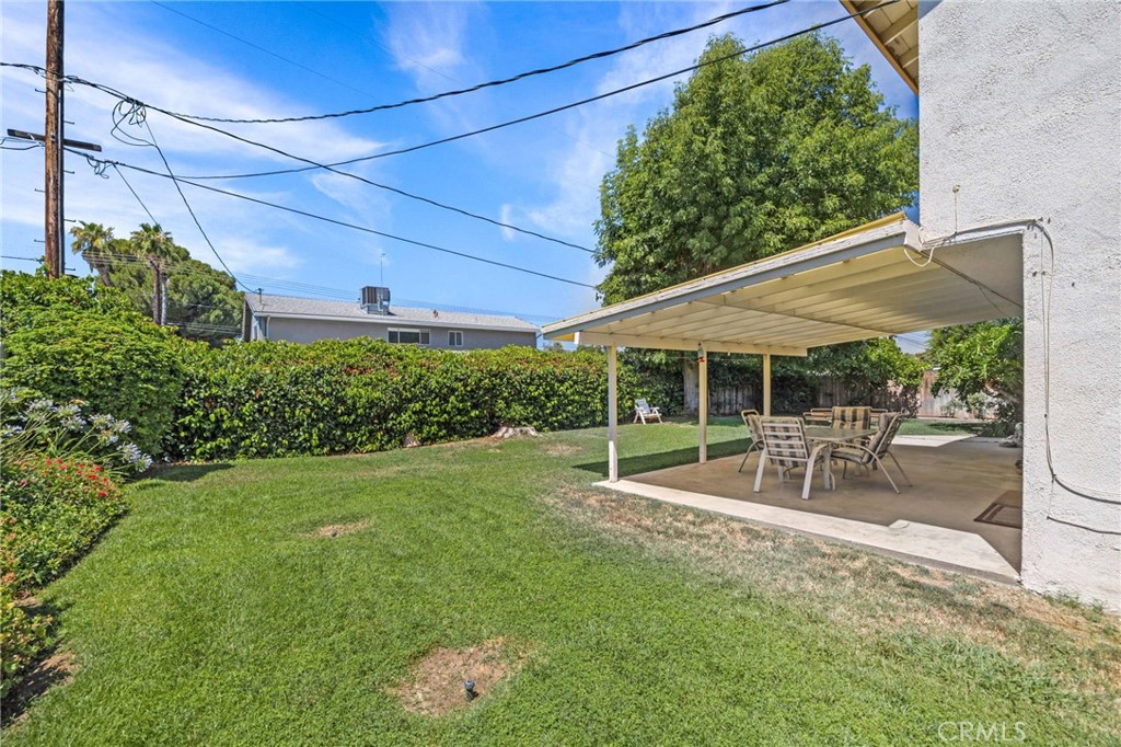 2994 Bautista Street Riverside, CA 92506 - Photo 36 of 37 a view of a patio with table and chairs and potted plants
