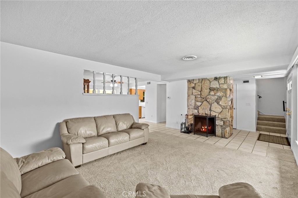 2994 Bautista Street Riverside, CA 92506 - Photo 9 of 37 a living room with furniture and a fireplace