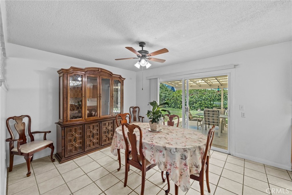 2994 Bautista Street Riverside, CA 92506 - Photo 10 of 37 a view of a dining room with furniture window and wooden floor