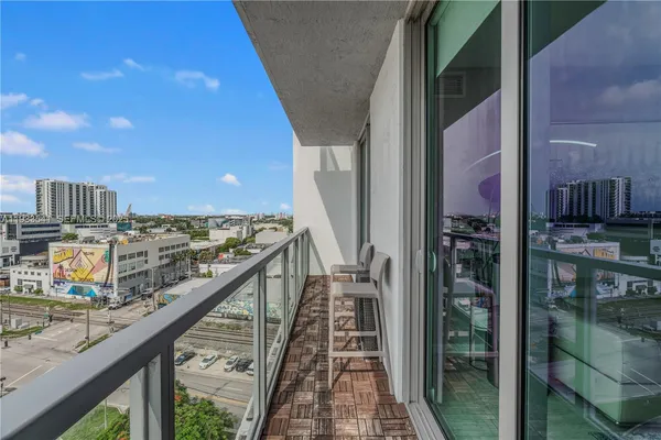 a view of balcony with furniture