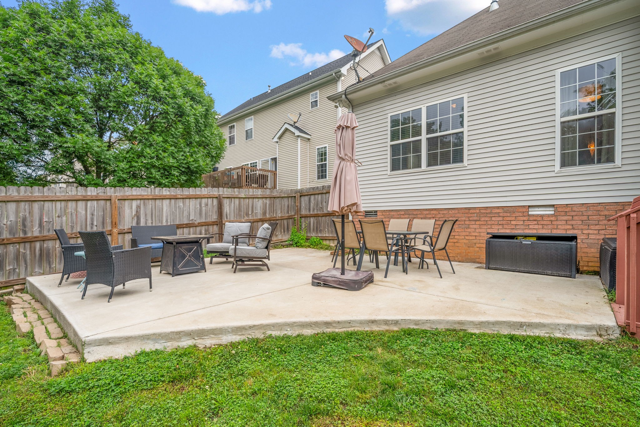 1161 Cynthia Lane Spring Hill, TN 37174 - Photo 34 of 42 a view of a patio with a table and chairs