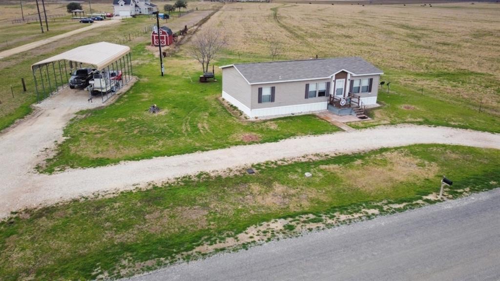 5101 County Road 463 Elgin, TX 78621 - Photo 4 of 6 a front view of a house with garden