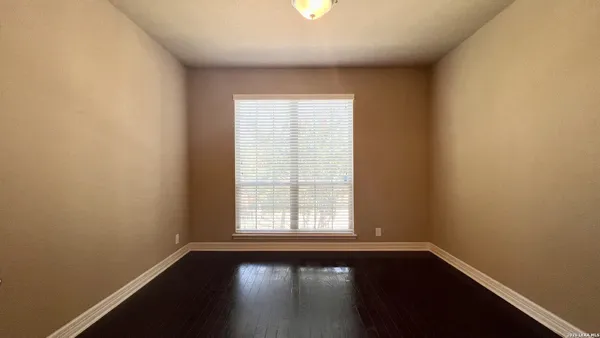 a bathroom with a glass door shower and a sink