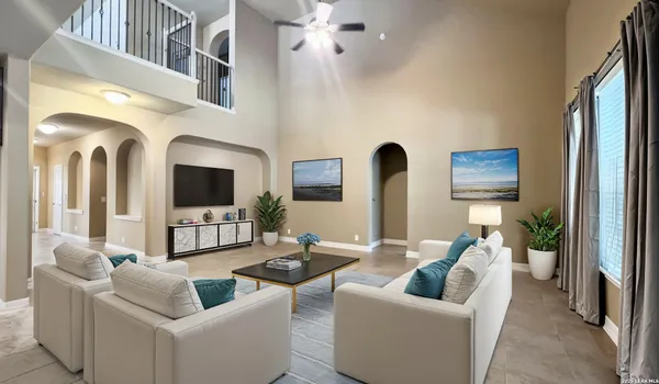 a living room with furniture and a flat screen tv