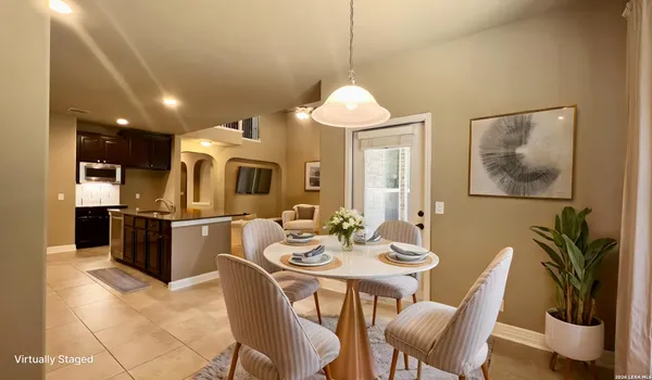 a view of a workspace with furniture and a bookshelf