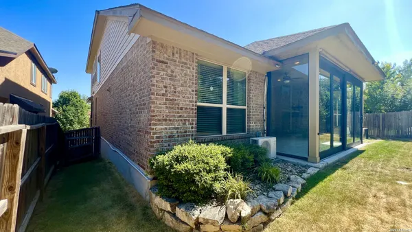 a picture of a room with a bench and a wooden floor