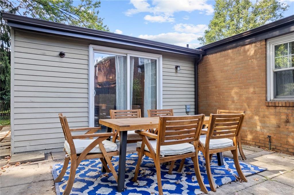 472 Sleepy Hollow Road Pittsburgh, PA 15228 - Photo 23 of 40 a view of a patio with table and chairs and wooden floor